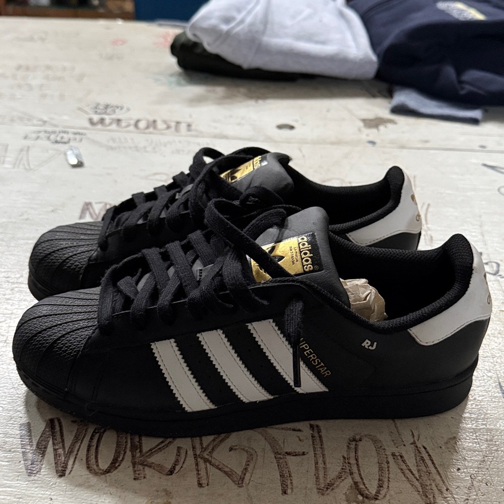 Men’s Adidas Superstar black and gold size 9
